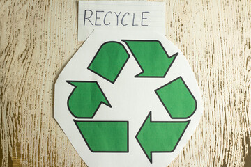 Overhead Angle of Recycle Text with a Recycle Symbol