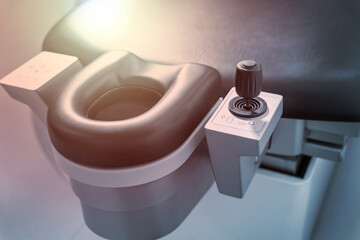 Ophthalmic laser system in eye surgery clinic. Close up of excimer laser couch in operating room © thomsond