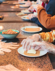 Group of children in a cooking class, kids preparing asian style food in the kitchen together, kids in aprons learn cooking on master class, chef uniform, hands in gloves