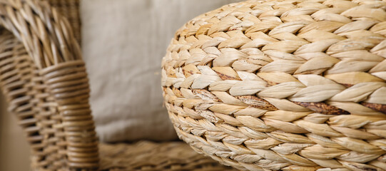 Obraz premium Stylish rattan furniture in room, closeup
