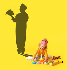Playing baby girl with toys and silhouette of chef on yellow background