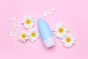 Composition with cosmetic product and fresh chamomile flowers on pink background