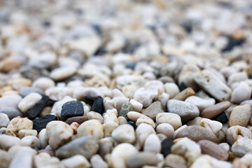 Trendy small sea stone pebble background. Softcolored abstract beach nature pattern