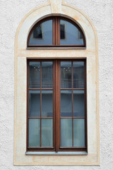 Fototapeta na wymiar View of old building with wooden window