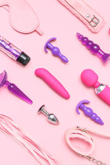 Different sex toys on pink background