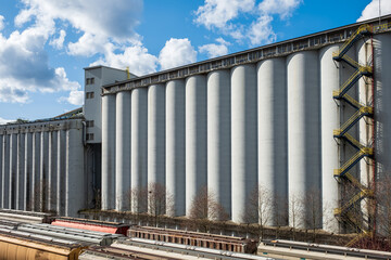 Grain silos elevator. A agrarian facility complex designed to stockpile. High concrete structure.
