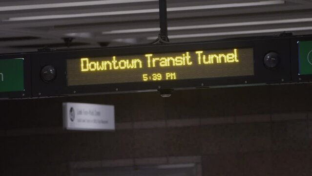 Panning across signs in downtown subway station in Seattle Washington