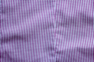 purple fabric texture background . checkered pattern