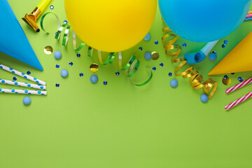 Different accessories for birthday party on green background, flat lay. Space for text
