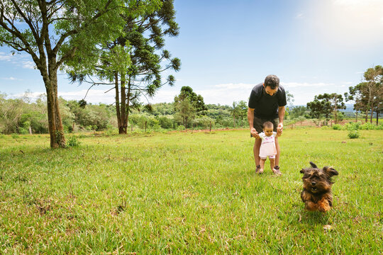 Baby Girl In His First Steps With Her Daddy.