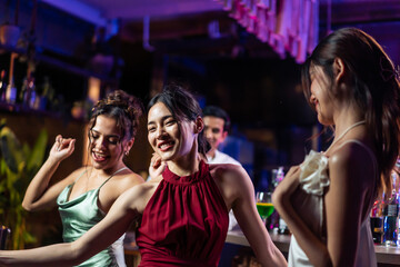 Fototapeta Asian beautiful women having fun, meeting each other in bar restaurant. obraz
