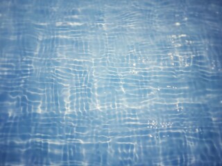 Defocus blurred transparent blue colored clear calm water surface texture with splashes and bubbles. Trendy abstract nature background. Water waves in sunlight with copy space. Blue water shine