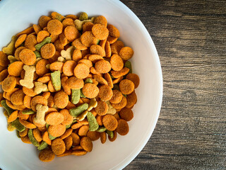 Dog food ready to eat on the wood background