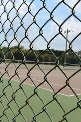 Tennis court at the park during the day time 