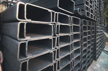 Light-edged channel steel or C-channel steel Steel roof structure. Construction of steel buildings,...