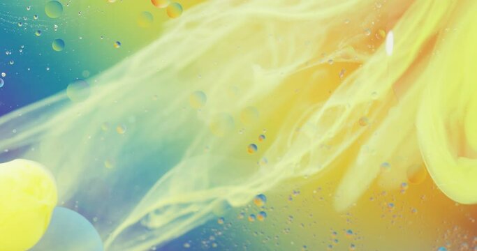 Animation of bubbles and yellow liquid moving on blue and orange background with copy space