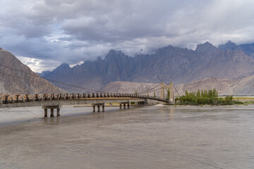 A bridge in Karakoram high mountain hills. Nature landscape background, Skardu-Gilgit, Pakistan....