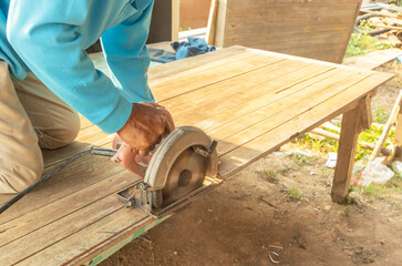 Hands of male carpenter is working woodworker.
