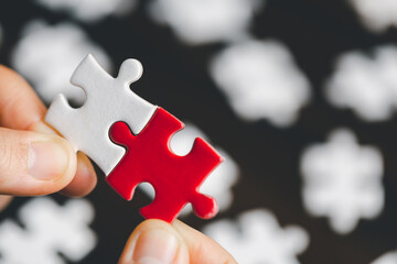 Business woman person hand holding puzzle piece idea for strategy and solution. Closeup part of two...