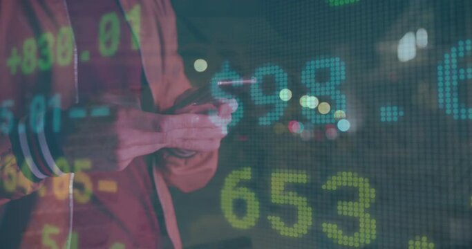 Animation of stock market over caucasian businessman using smartphone