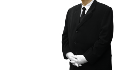 professional service worker in black suits wearing white gloves standing.