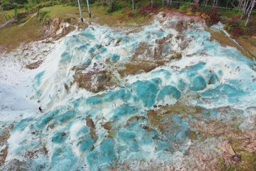 Bird's eye view drone shot over Blue Soil Hills in Sagada, Philippines enclosed pine forest.