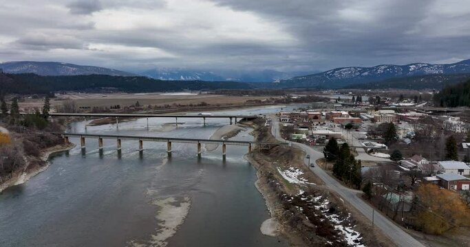 Bonners Ferry Idaho USA Aerial Drone Overview Establishing Shot Kootenay River Bridges Mountain Background