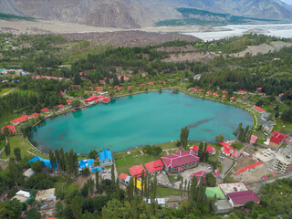 Aerial top view of heart love shape pond river lake in Karakoram high mountain hills. Nature landscape background, Skardu,Gilgit, Pakistan. Travel on holiday vacation. - obrazy, fototapety, plakaty