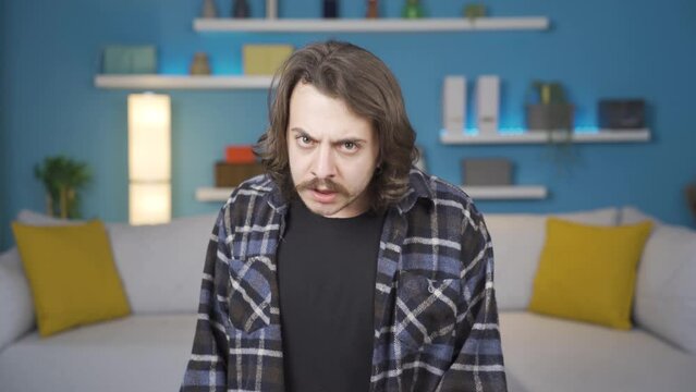 Angry man looking at camera. Gestures.
Very angry man looking at camera and getting angry.
