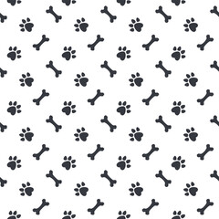 Fototapeta na wymiar Seamless pattern cute paw dog, bone toy, and footprint design background for wallpaper, wrapping, paper, fabric. Vector illustration.