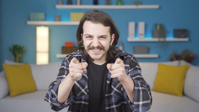 Man giving motivational speech to camera. Gestures.
The man tells the camera that he can be successful. Motivational speech.
