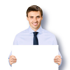 Portrait image of business man professional bank manager in confident cloth necktie holding showing empty white banner signboard paper poster with copy space area. Isolated against white background