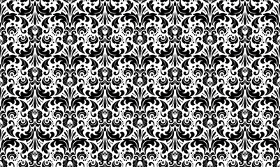 Wallpaper in the style of Baroque. Seamless vector background. White and black floral ornament. Graphic pattern for fabric, wallpaper, packaging. Ornate Damask flower ornament