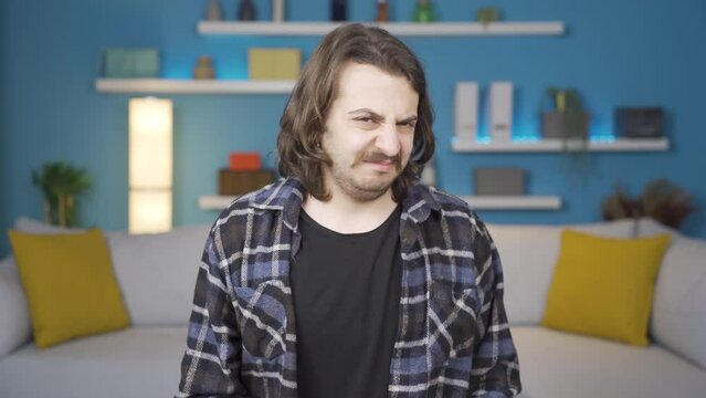 The guy who's about to vomit. Negative reaction to the camera.
The guy who's about to throw up because of something he doesn't like. He is looking at the camera. Reaction.
