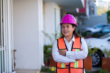 Woman Engineer working on a construction with a vest
