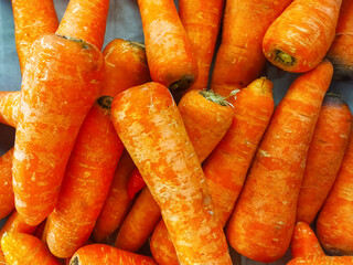 Pile of fresh orange carrots ready to sell.