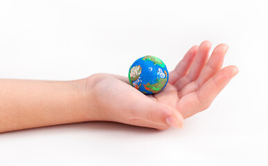 In the hand of a man lies a small plasticine globe.