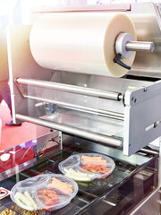 Industrial machine for packing in food industry