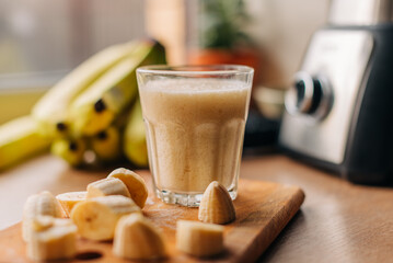 Smoothie with banana and oatmeal for breakfast on a light concrete background. Detox menu.