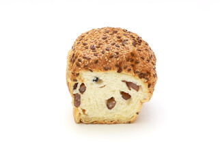 Slice wheat bun, sprinkled with flax and sesame seeds on white background