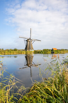 Vertical picture of one of the famous Dutch windmills at Kinderdijk, a UNESCO world heritage site. On the photo is one mill of the 19 windmills at Kinderdijk, South Holland, the Netherlands, which are