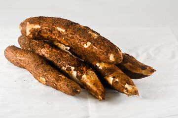 some freshly harvested cassava from the garden isolated on a white background