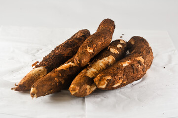 some freshly harvested cassava from the garden isolated on a white background