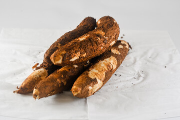 some freshly harvested cassava from the garden isolated on a white background