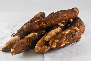 some freshly harvested cassava from the garden isolated on a white background