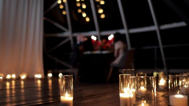 Blurred picture of romantic candlelit dinner for a couple in love