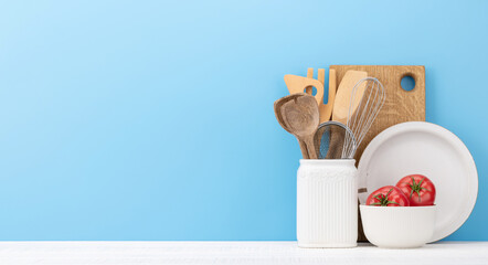 Kitchen utensils on wooden table