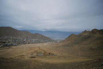 Beautiful landscape with greenery in a village, the background is surrounded by mountains at Leh town, Ladakh, in the Indian Himalayas.