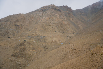 Beautiful view of Khardung La Pass- Leh road on the high mountain covered with snow. It is the highest pass in the world that motorbikes can run through at Ladakh, Leh, India