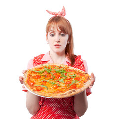 Housewife holding a homemade pizza